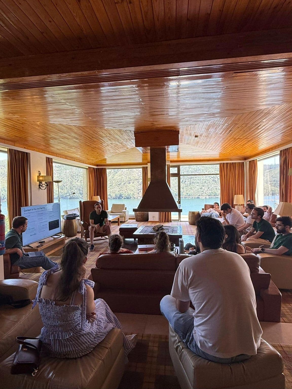 The LoopOS team gathered in a lakeside lodge during the Spring Retreat at Lago Azul.