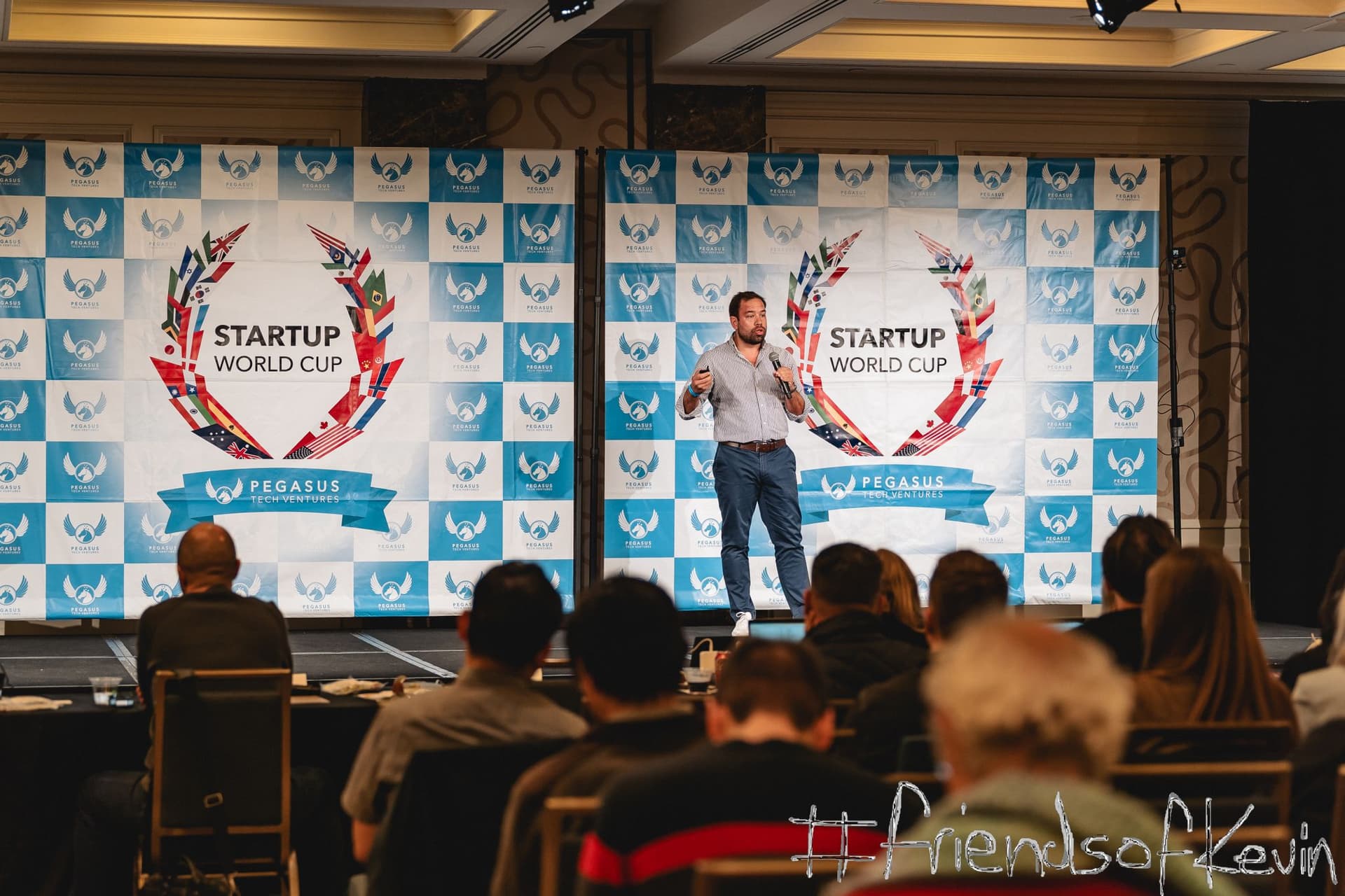 LoopOS pitching on stage at the Startup World Cup semi-final.